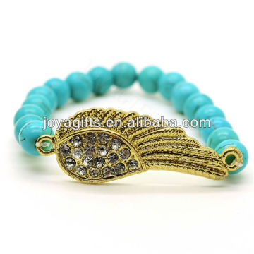 Fashion Turquoise 8MM Runde Perlen Stretch Edelstein Armband mit Diamante Wing in der Mitte